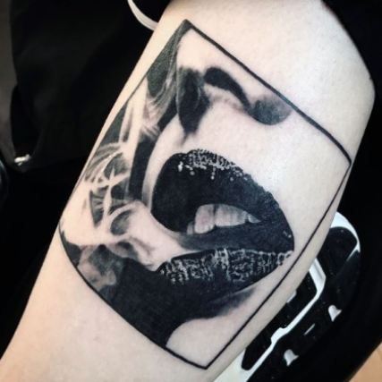 Darl Papple photorealism tattoo artist in Michigan lip portrait sexy smoking